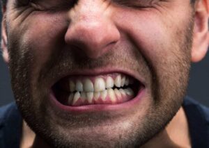 patient suffering with teeth grinding